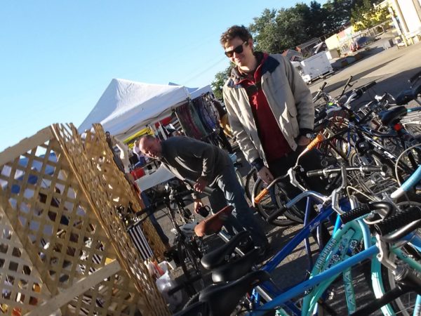 John and Seth setting up bikes at the flea off